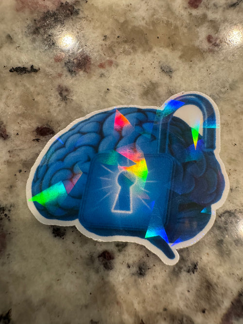 A die-cut holographic sticker featuring a blue brain and padlock.